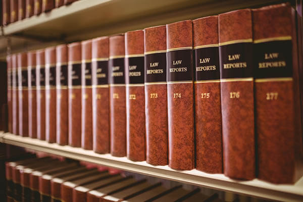 Workers comp law books on shelf